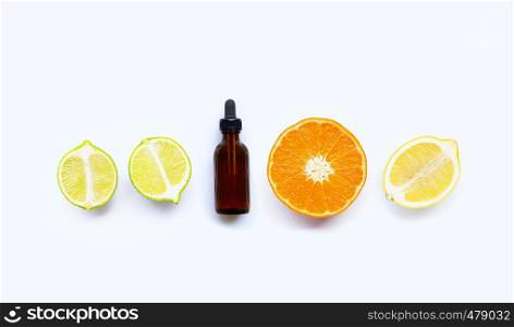 Essential oil with citrus tropical fruit isolated on white background