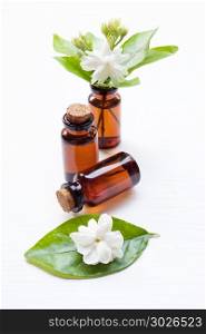 Essential oil with jasmine flower.. Essential oil with jasmine flower on white background.