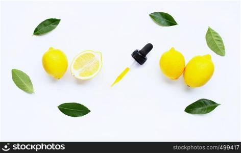 Essential oil with lemon on white background.