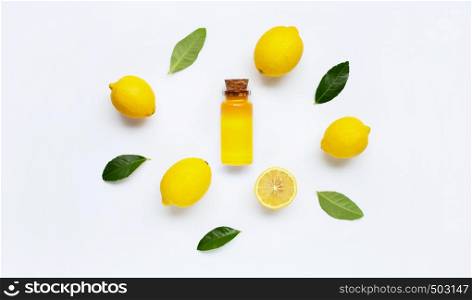 Essential oil with lemon on white background.