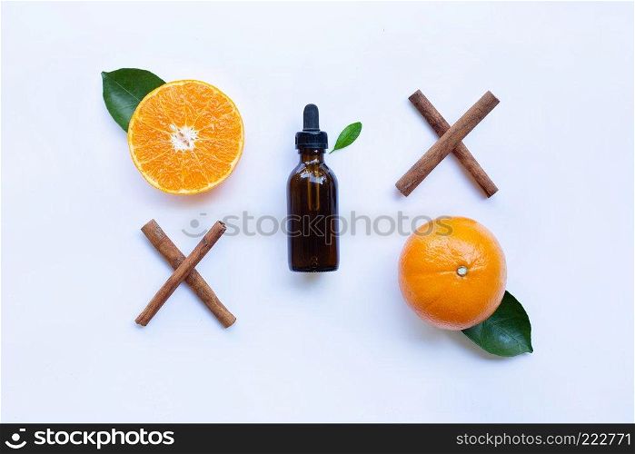 Essential oil with orange and cinnamon stick