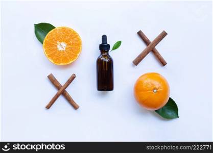 Essential oil with orange and cinnamon stick