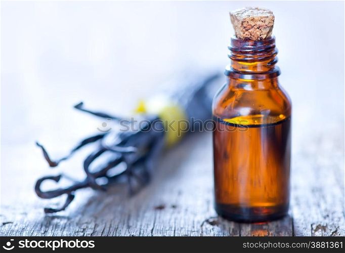 Essential oil with vanilla on a table