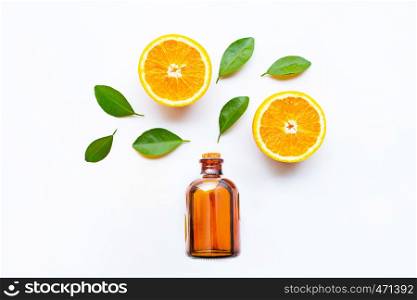 Essential with fresh orange citrus fruits with leaves on white background. Top view