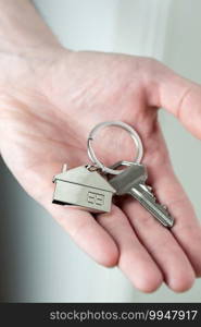 Estate agent giving house keys to client for new home, contract real estate for mortgage approved, focus on keys, business, financial, Estate concept close to. Estate agent giving house keys to client for new home, contract real estate for mortgage approved, focus on keys, business, financial, Estate concept