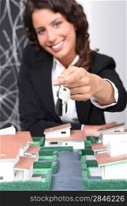 Estate agent handing over keys