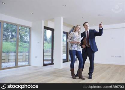 Estate Agent Showing Prospective Female Buyer Around Property
