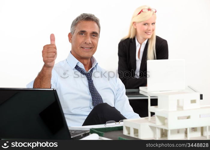 Estate agent with thumbs up