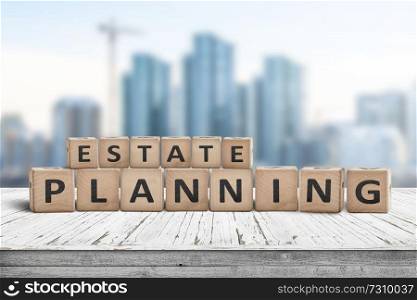 Estate planning sign on a wooden pier with tall buildings in the background