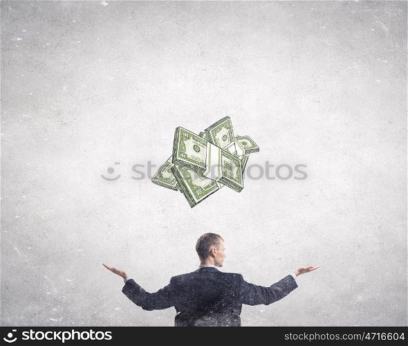 Estimate your money income. Confident businessman with hands spread apart presenting money earning concept