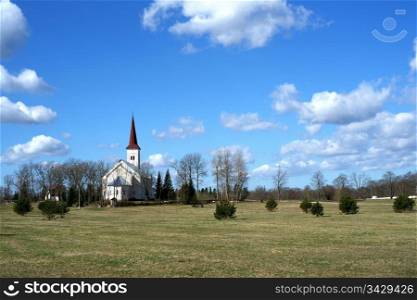 Estonia. Beautiful operating church on a background of the sky and clouds