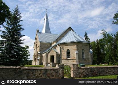 Estonia. Juri.Beautiful operating church on a background of the sky and clouds