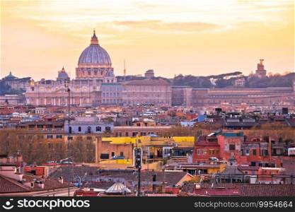 Eternal city of Rome rooftops and Vatican Basilica of Saint Peter golden sunset view, capital of Italy 