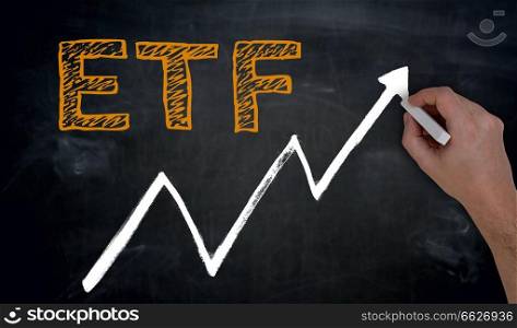 ETF and graph is written by hand on blackboard.. ETF and graph is written by hand on blackboard