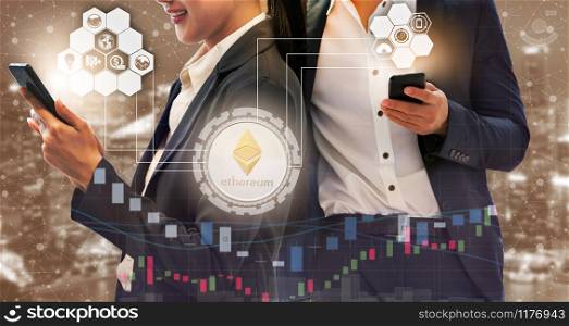 Ethereum and cryptocurrency investing concept - Businessman using mobile phone application to trade Ethereum ETH with another trader in modern graphic interface. Blockchain and financial technology.. Ethereum ETH and Cryptocurrency Trading Concept