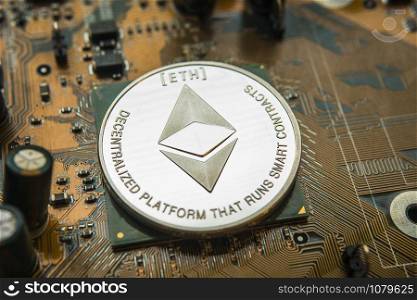 ethereum. Crypto currency ethereum. ethereum coin on exchange charts. e-currency ethereum on the background of the circuit motherboard