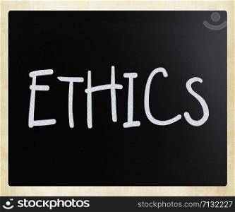""Ethics" handwritten with white chalk on a blackboard"