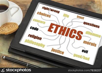 ethics word cloud or mind map on a digital tablet with a cup of coffee