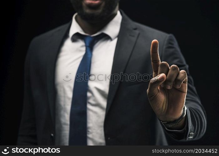 ethnic businessman pointing up