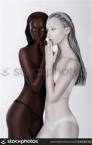 Ethnicity. Fantasy. Futuristic Women Painted White and Black. Art Bodypainting