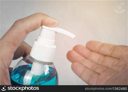 Ethyl Alcohol gel sanitizer,Men holds bottle for cleaning hand and used as disinfectant,Covid-19,Corona virus.