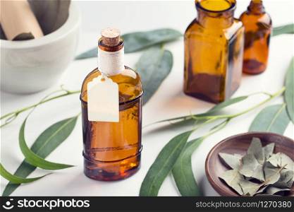 Eucalyptus essential oil with homemade tag. Eucalyptus oil for aromatherapy, spa, herbal remedies