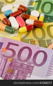euro bank notes and tablets. image medienkamente, medical and health expenses