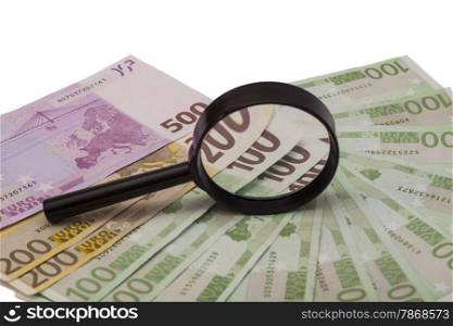 Euro banknote under magnifying glass on white