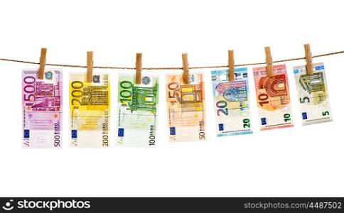 Euro banknotes hanging a rope with clothes pins. Money background. Money laundering concept