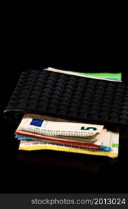 Euro banknotes in black wallet isolated.