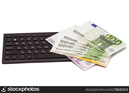 Euro banknotes on keyboard