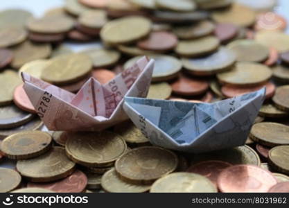 Euro boats sailing on a euro coin sea