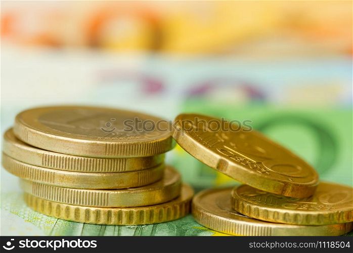 Euro coins close-up on banknote background