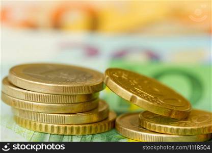 Euro coins close-up on banknote background