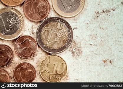 Euro coins currency on canvas background with copy-space.Vintage tone and grain.