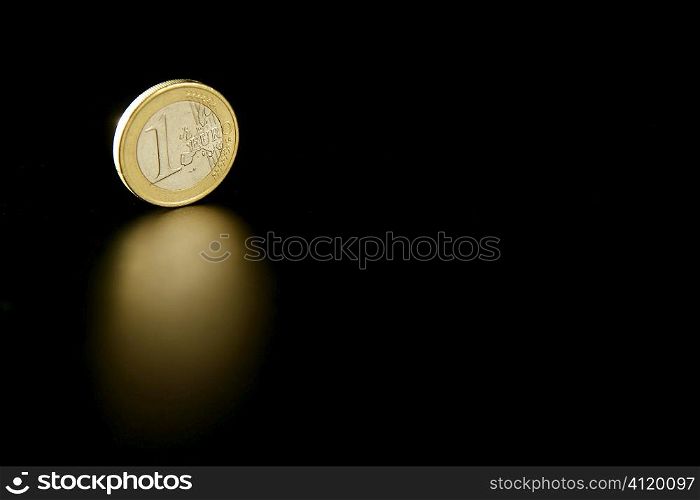 Euro currency coin macro with reflection