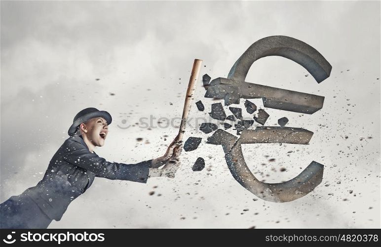 Euro currency fall. Young pretty woman in suit and hat crashing euro sign with baseball bat