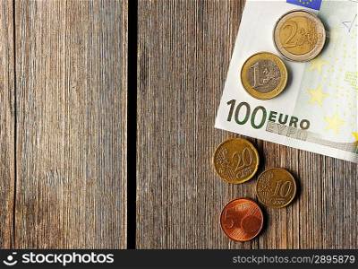 Euro currency over wooden background