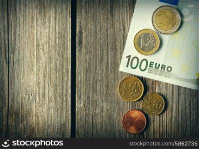 Euro currency over wooden background