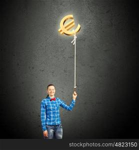 Euro currency. Young girl in casual holding euro symbol on rope