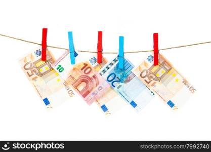 Euro notes on clothesline. Money laundering euros