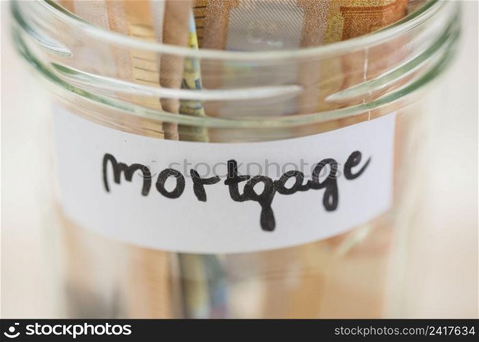 euro notes saving mortgage glass jar