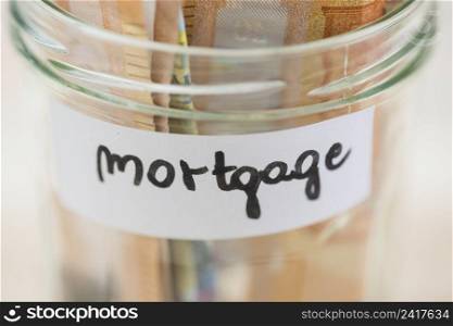 euro notes saving mortgage glass jar