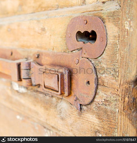 europe old in italy antique close brown door and rusty lock closeup