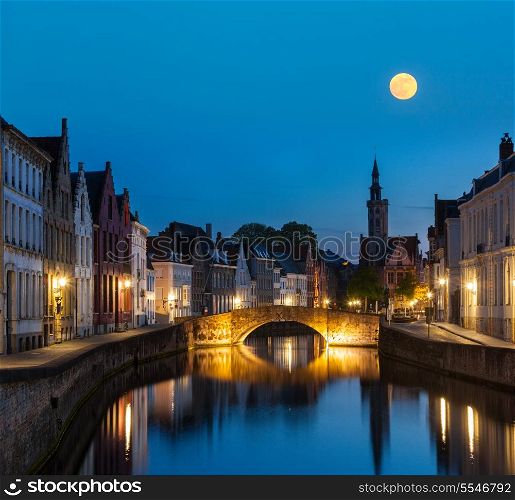 European medieval night city view background - Bruges (Brugge) canal in the evening, Belgium