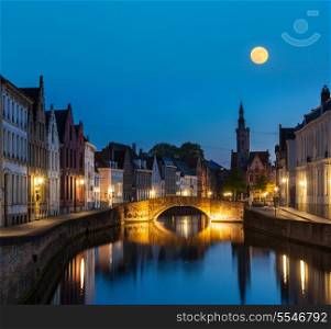 European medieval night city view background - Bruges (Brugge) canal in the evening, Belgium