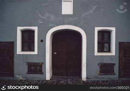 European style facade with rolling shutter on windows and door