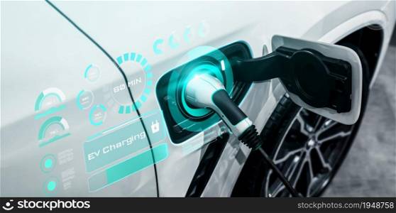 EV charging station for electric car in concept of alternative green energy produced from sustainable resources to supply to charger station in order to reduce CO2 emission .. EV charging station for electric car in concept of alternative green energy