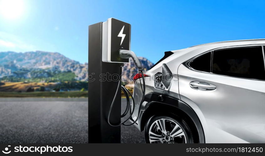 EV charging station for electric car in concept of green energy and eco power produced from sustainable source to supply to charger station in order to reduce CO2 emission .. EV charging station for electric car in concept of green energy and eco power