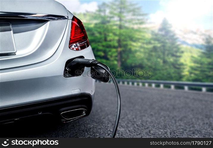 EV charging station for electric car in concept of green energy and eco travel . The electric power is produced from sustainable resource to supply to charger station in order to reduce CO2 emission .. EV charging station for electric car in concept of green energy and eco travel